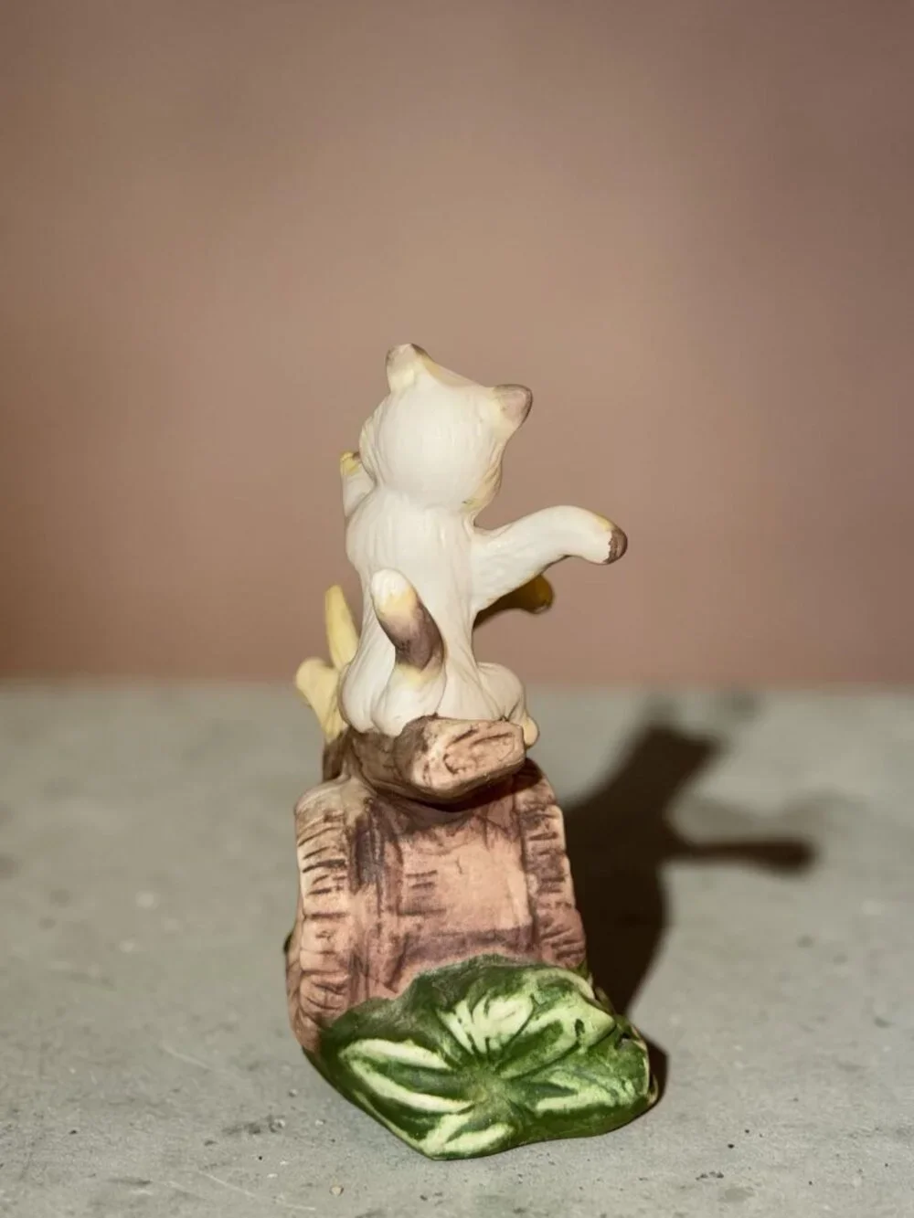Vintage Ceramic Figurine Of Two Playful Cats On Log With Green Leaves